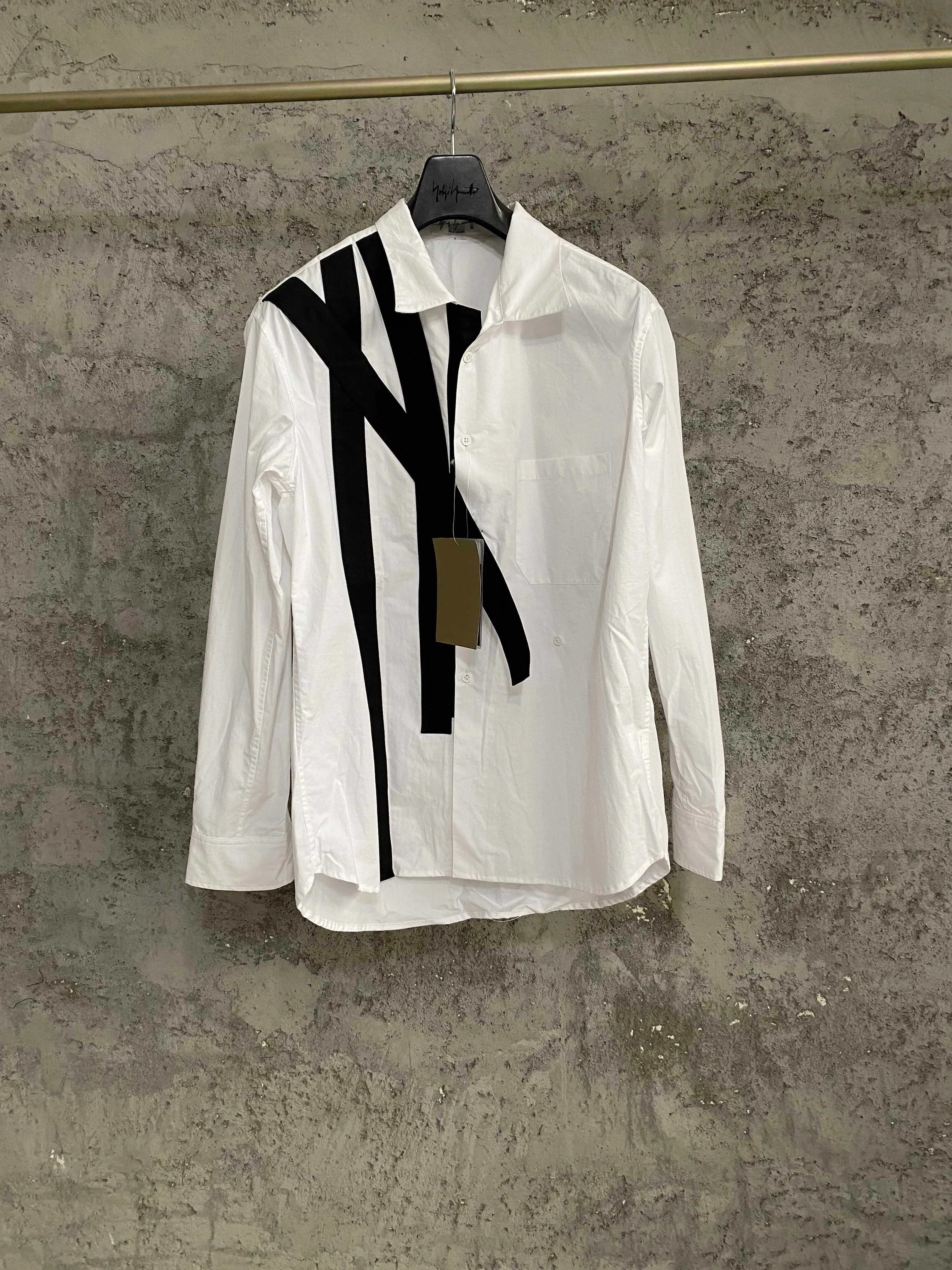 Chemise à manches longues à col double boutonnage de couleur unie avec un col simple et tendance, en