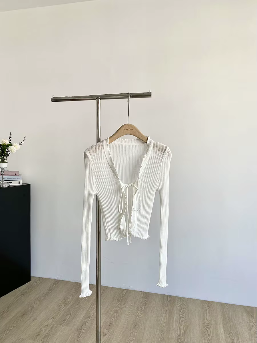 Cardigan en tricot côtelé avec cravate sur le devant, garniture à volants, haut court léger et trans