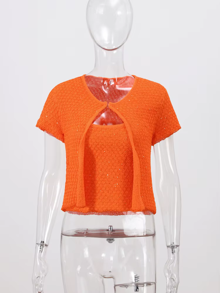Haut court en tricot perlé à bouton unique pour femme