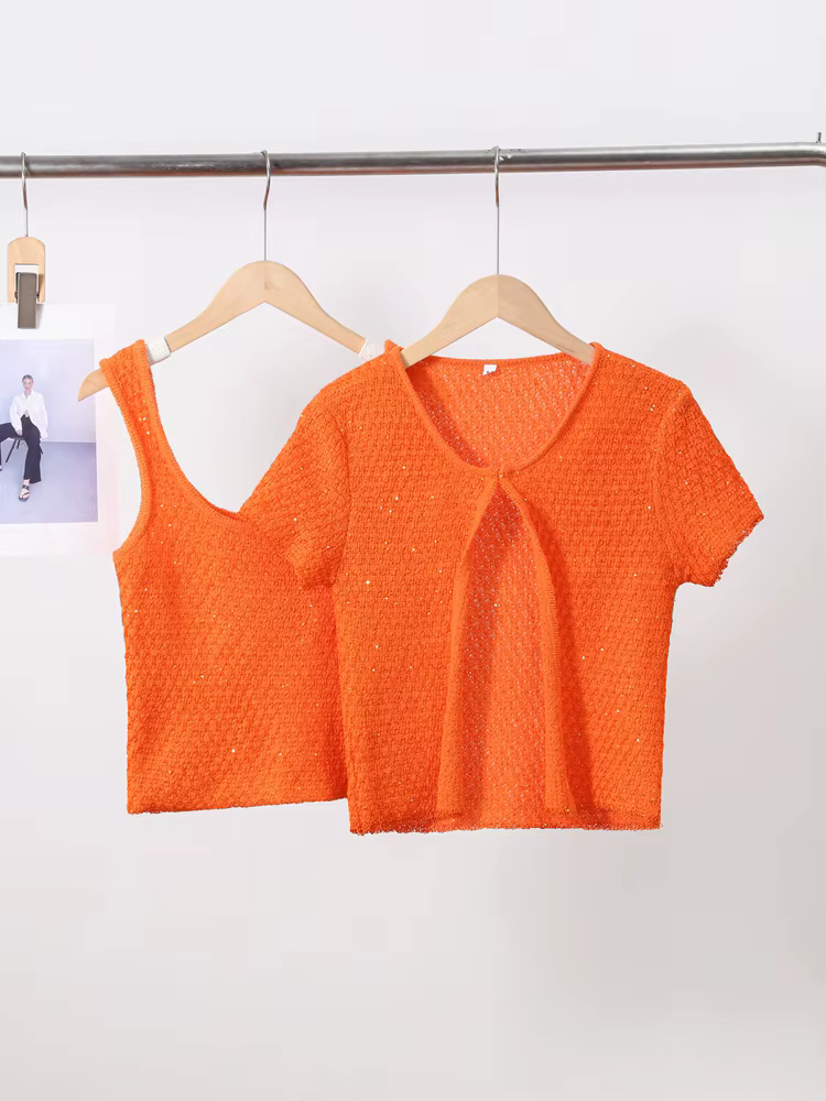 Haut court en tricot perlé à bouton unique pour femme
