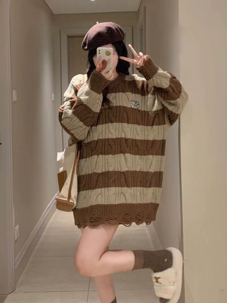 Pull rayé torsadé déchiré pour femme