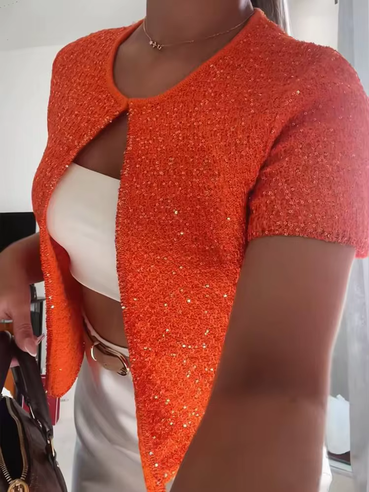 Haut court en tricot perlé à bouton unique pour femme