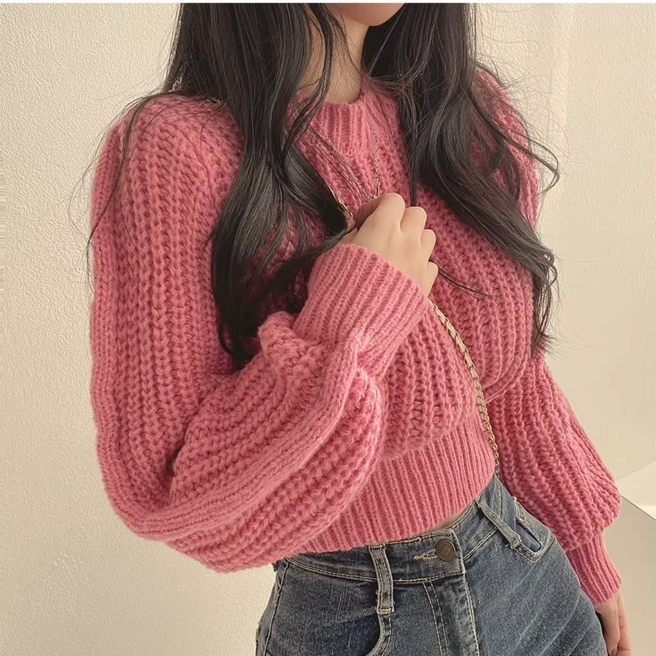 Pull rose à manches bouffantes
