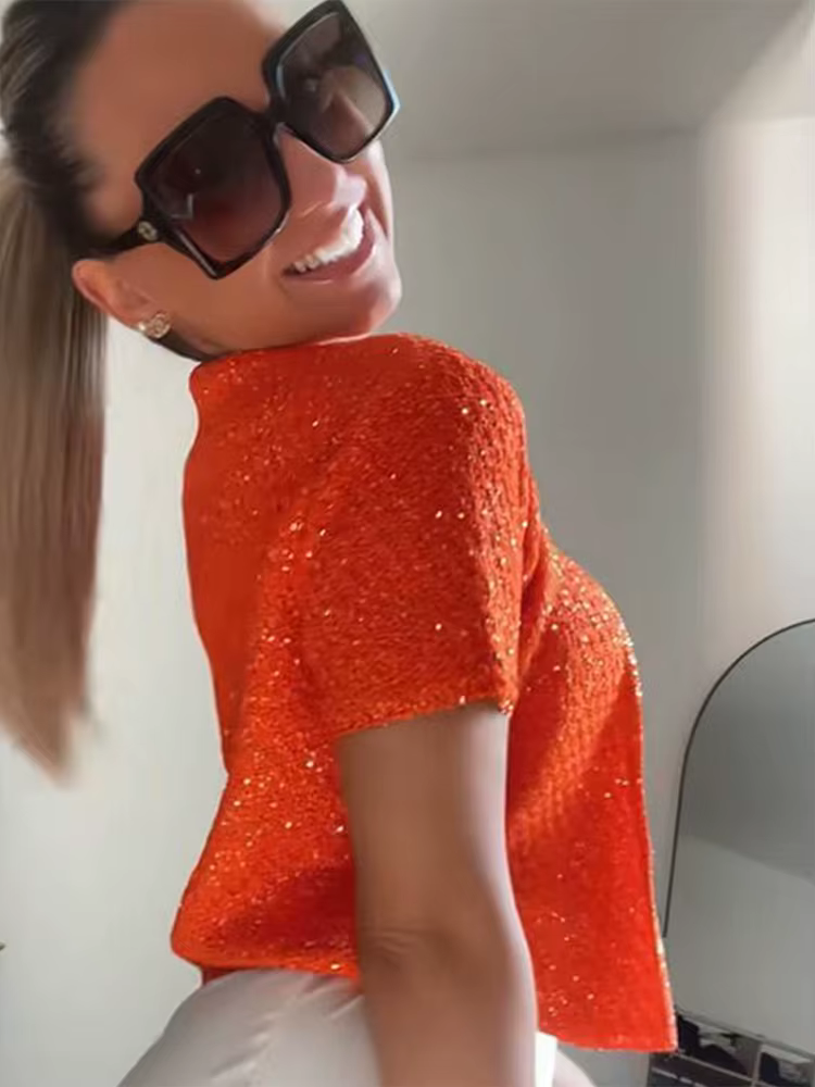 Haut court en tricot perlé à bouton unique pour femme